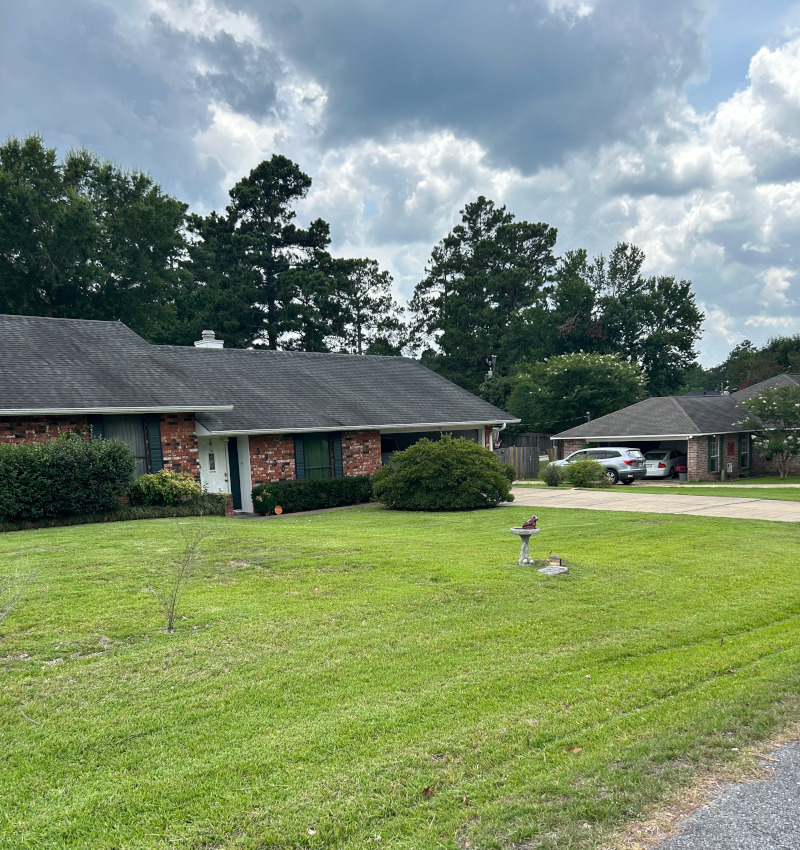 Lot front yard mowing at Pineville, Louisiana home.